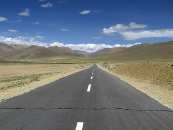 Empty road against sky