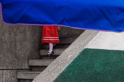 Low section of person standing on sidewalk