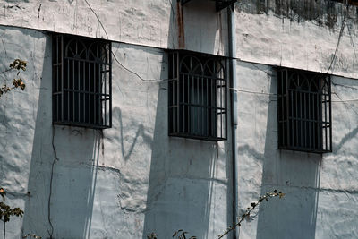 Low angle view of window on old building