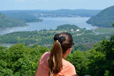 Rear view of woman against landscape