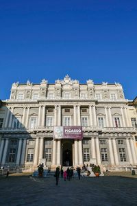 Low angle view of historical building against blue sky