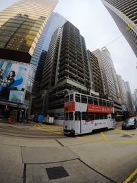 View of city street and buildings against sky
