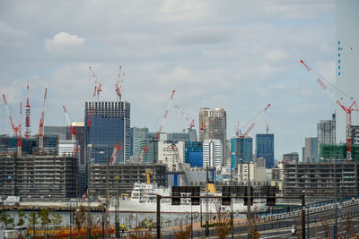 Modern buildings against sky in city