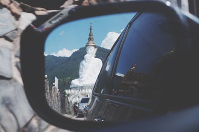 Reflection of buildings on car windshield