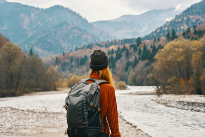 Rear view of woman looking at mountains