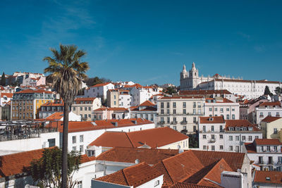 Buildings in city against sky