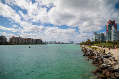 Panoramic view of sea and buildings against sky