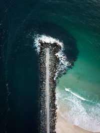 High angle view of sunlight falling on sea shore