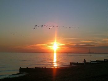 Scenic view of sea at sunset