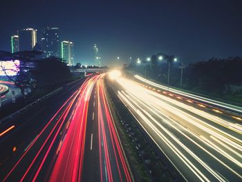 High angle view of light trails on road at night