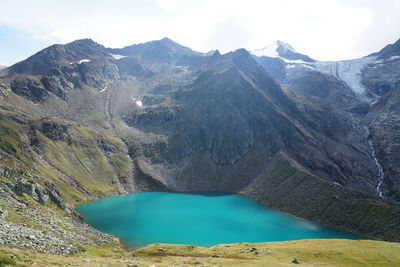 Scenic view of lake and mountains against sky