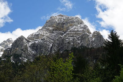 Low angle view of rock formations against sky