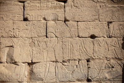 Different hieroglyphs on the walls and columns in the karnak temple.