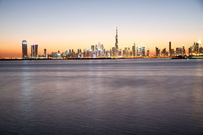 Dubai skyline from dubai creek harbour and dubai canal to downtown and business bay, uae