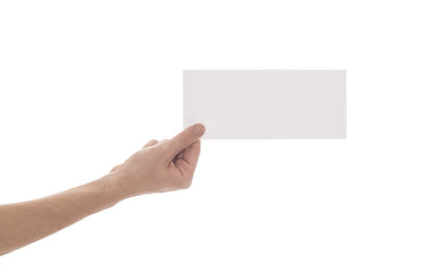 Hand holding paper against white background