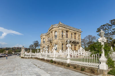 Low angle view of historical building against blue sky