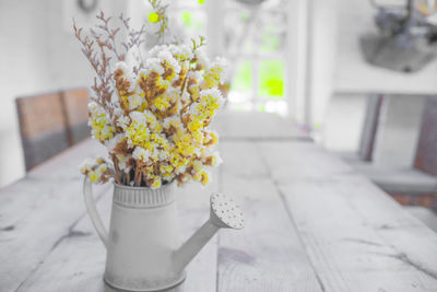 Close-up of white flower pot on table