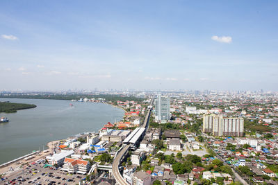 High angle view of buildings and city against sky
