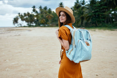 Young woman standing on beach