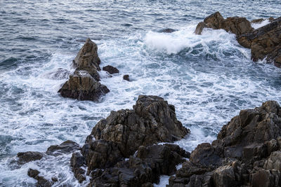 Scenic view of rocks in sea