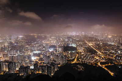 Aerial view of city lit up at night