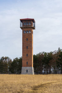  observation tower on field against sky