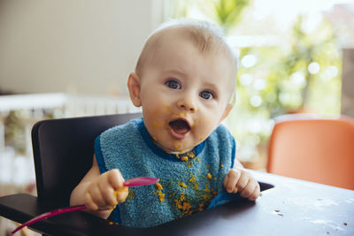 Portrait of baby boy after having a meal