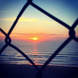 Scenic view of sea at sunset