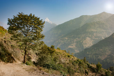 Scenic view of mountains against blue sky