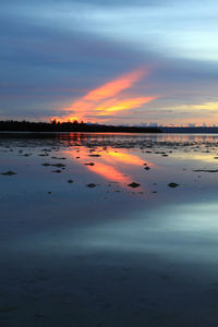 Scenic view of sea against romantic sky at sunset