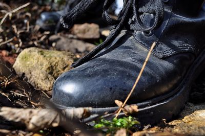 Close-up of black boot