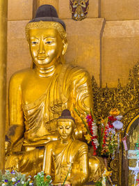 Buddha statue in temple outside building