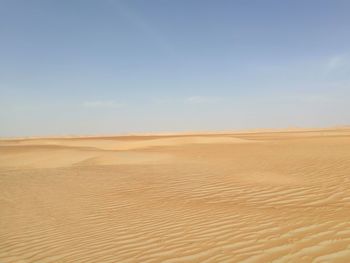 Scenic view of desert against clear sky