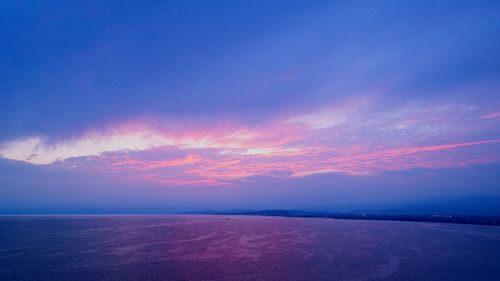 Scenic view of sea against sky at sunset