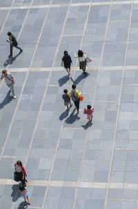 High angle view of people on footpath in city