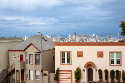 San francisco, california, united states - houses on twin peaks neighborhood and downtown skyline.