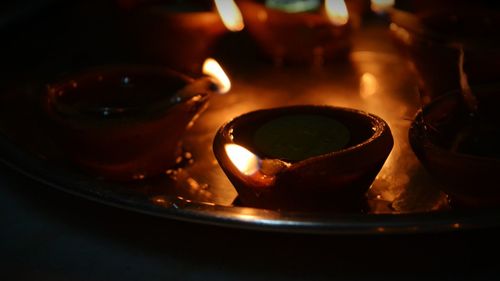 Close-up of lit tea light candles