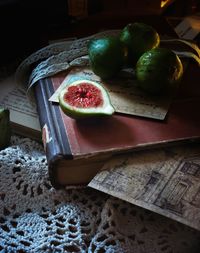 High angle view of figs on book at home