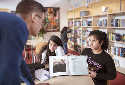 Teenage girls in library