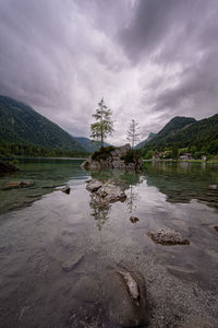 Scenic view of lake against sky with reflections. 