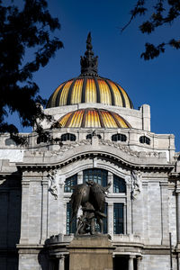 Low angle view of statue against building