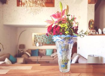 Close-up of flower vase on table at home