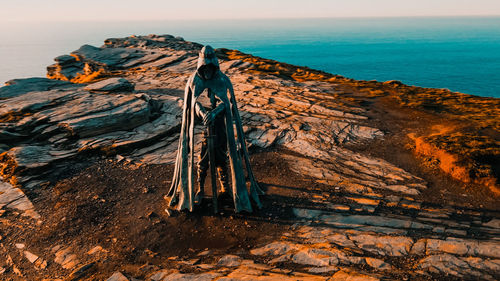 Aerial view around the monument to king arthur in britain monument close up on sea background.