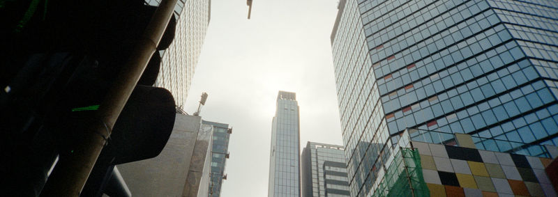 Low angle view of modern buildings against sky