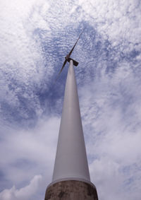 Low angle view of traditional windmill against sky