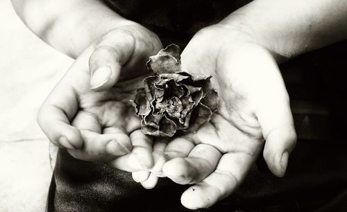 Close-up of man holding hands