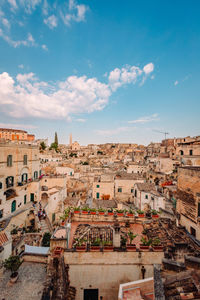 Wide view of the sassi of matera from the luigi guerricchio belvedere, blue sky with clouds