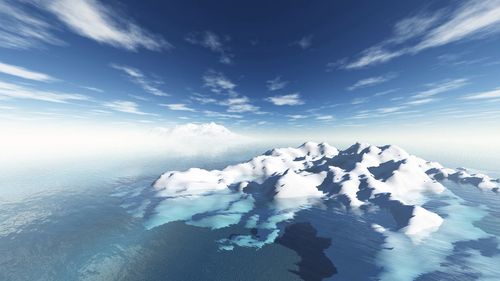 Scenic view of mountains against cloudy sky