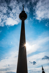 Low angle view of fernsehturm in city against sky