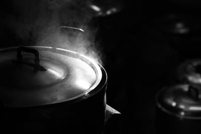 Close-up of steam emitting from cooking utensil